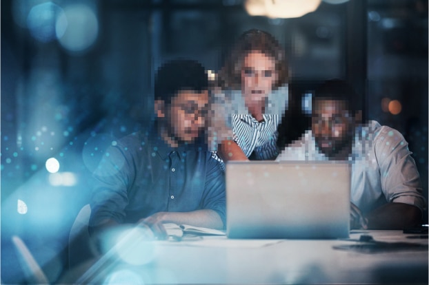 Three IT professionals with blurred faces protecting identity